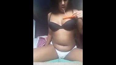INDIAN slut using carrot as a dildo.