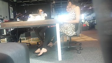 Indian Girl dangling under the table