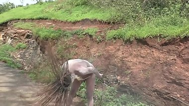 naked indian sadhu whips hair back and forth
