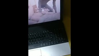 Jerking off to a porn video solo. My first attempt to shoot a video.